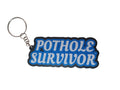 Pothole Survivor Keychain – Funny Driver Keyring